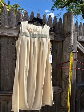 Calvin Klein size 8 satin butter color dress with gold sequin accents!! NWT!!